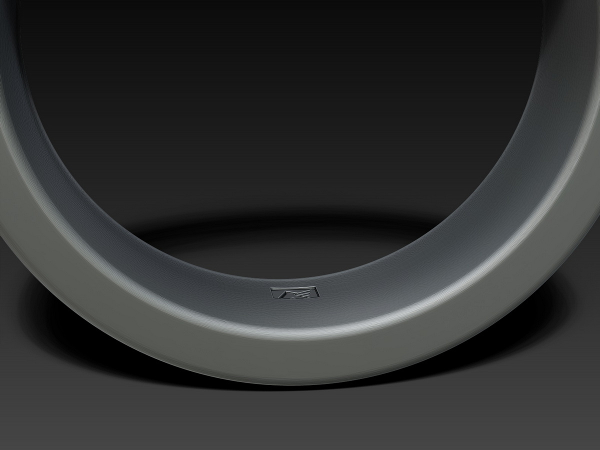 Close-up of the Monaco Felice MF maker’s mark engraved into the smooth inner surface of the ornamental ring.